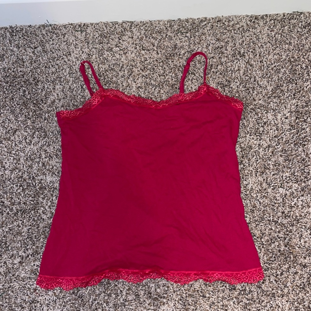 I am selling a red spaghetti strap lace blouse. Good quality and condition!!